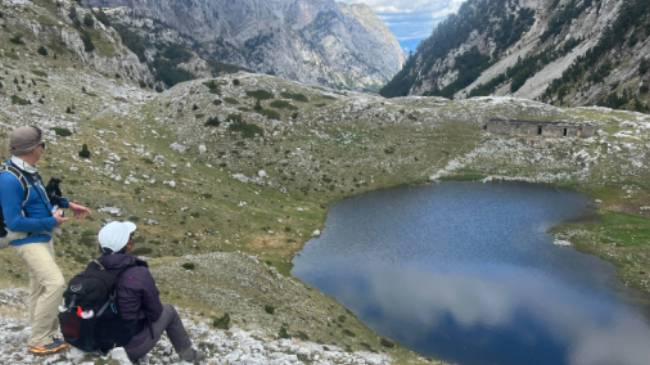 Hikers absorbing the view on the Peaks of the Balkans trail in Albania | Kate Baker