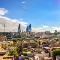 Baku, the cosmopolitan capital of Azerbaijan, where ancient Zoroastrian fire temples meet modern glass sky scrapers.